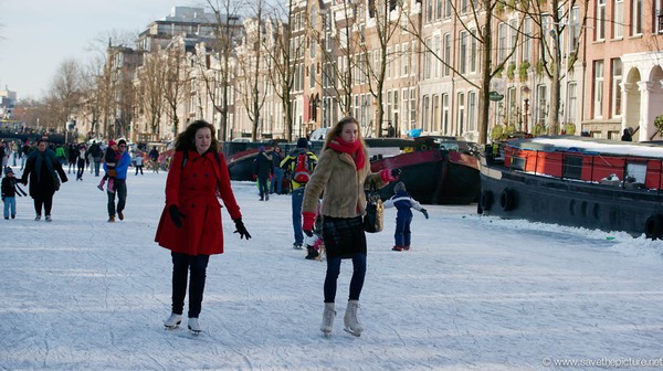 Amsterdam frozen canals, ice skaters