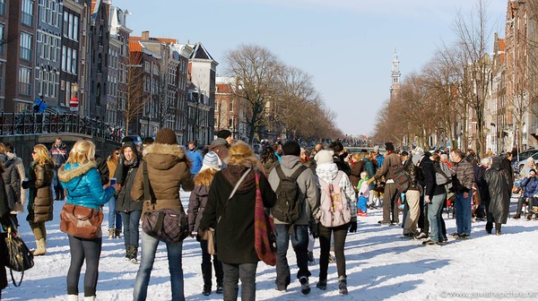 Amsterdam frozen canals, tourists