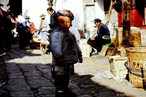 Lijiang Naxi boy in the shadow