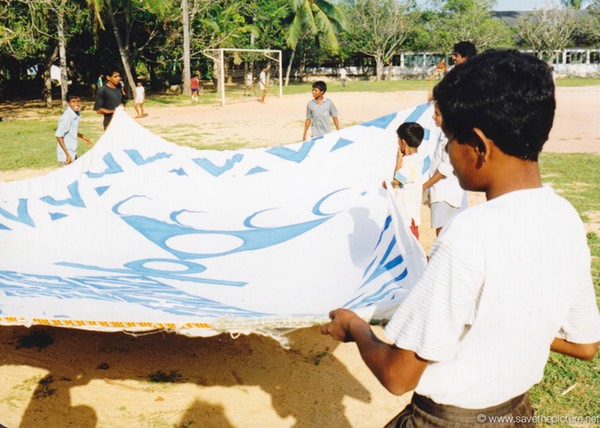 Sri Lanka catamaran art, folding the painted sails