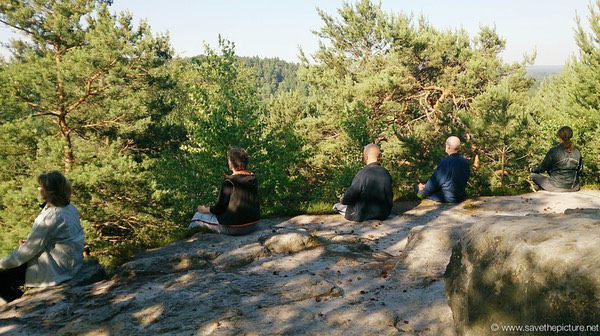 Taikiken sitting in stillness on the ridge of the mountain top